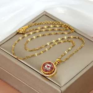 Gold vintage spinning cardinal bird pendant necklace with micro-pave zircon crystals