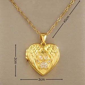 Detail view of a 45cm gold locket necklace with angel wings and zircon paw pattern