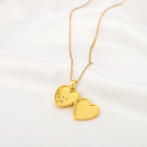 Macro detail of gold heart-shaped locket pendant with openable photo frame structure