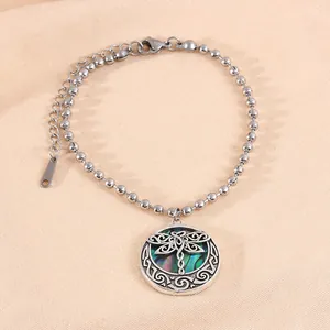 Polished stainless steel bead bracelet featuring a colorful dragonfly charm pendant