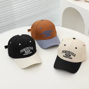 Detailed view of color-block kids baseball caps with 1995 premium 3D embroidery textures