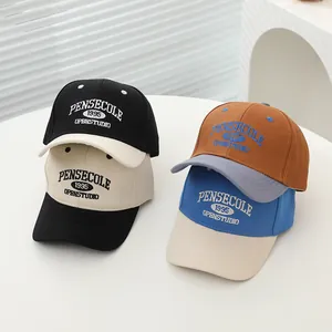 Detailed view of kids 1995 letter embroidery baseball caps in multiple color combinations