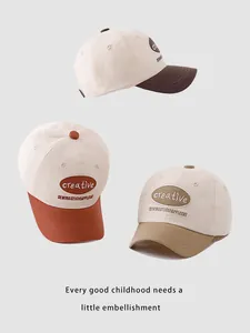 Detailed view of three cotton baseball caps with contrasting brims and creative embroidery