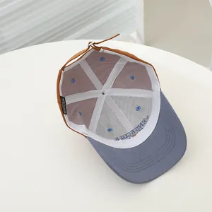 Detail showing the internal six-panel structure and adjustable strap of kids baseball cap