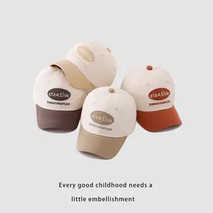 Kids' color-block baseball caps with Creative embroidery shown in four earthy colorways