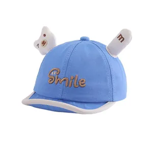 Blue baby baseball cap with soft brim, smile embroidery and 3D bear ears on top