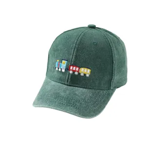 Kids green cotton baseball cap featuring a colorful cartoon train embroidery for sun protection