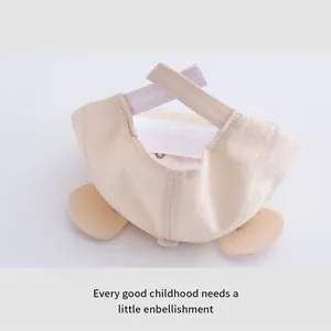 Detail view of cotton baby baseball cap with cute cat ears and adjustable velcro strap