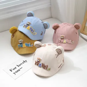 Detail view of baby sun hats in four colors with cute 3D bear ears and embroidery