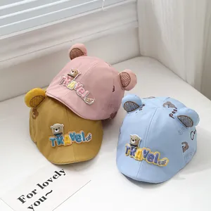 Cute baby sun hats with bear ears and embroidery in pink, yellow, and blue colors