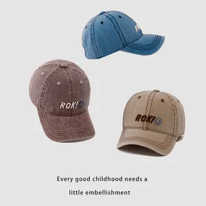 Three kids vintage washed cotton baseball caps with ROK embroidery and blue smileys