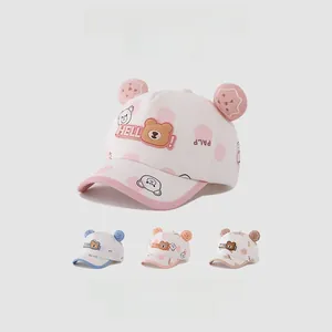 Detail of cartoon bear baseball cap featuring polka dots and cute 3D biscuit ears