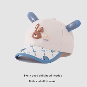 Cute beige and blue children's baseball cap with rabbit ears and bunny patch
