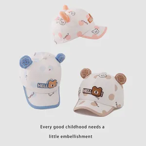 Kids baseball cap with bear ears in pink, blue, and brown cartoon design for sun protection