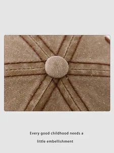 Detailed macro view showing khaki washed cotton fabric and precise stitching on cap crown