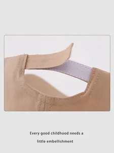 Detail of adjustable velcro strap on khaki cotton baseball cap for kids and toddlers