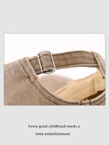 Detail of adjustable metal buckle and washed cotton texture on the back of the baseball cap