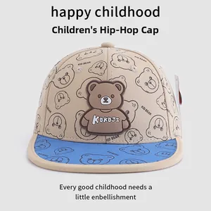 Detail of the 3D rubber bear patch and all-over cartoon print on children's hip hop hat