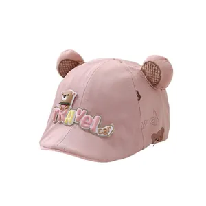 Pink baby sun hat with cute bear ears and stylish peak shown on a white background