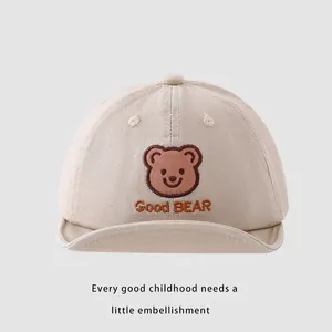 Close-up of bear embroidery and Good BEAR text on cotton baby baseball sun hat