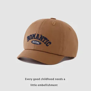 Kids cotton baseball cap in khaki brown with deep blue romantic embroidery detail