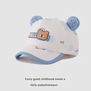 Detailed view of canvas baby baseball cap with 3D bear ears and HELLO embroidery