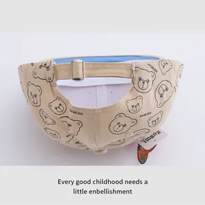 Detail of beige kids baseball cap with metal buckle and kid bear graphic print