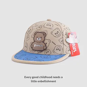 Close-up of kid bear flat brim baseball cap with khaki panels and blue brim