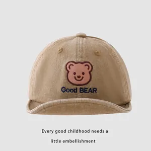 Detail of baby cotton baseball cap featuring cute bear patch and Good BEAR embroidery