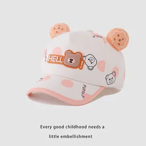 Detail of baby baseball cap with HELLO bear silicone patch and 3D cookie-shaped ears