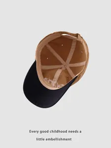 Detail view of khaki and black baseball cap interior with reinforced seams and air vents
