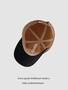 Internal view of a kids baseball cap showing reinforced seams and adjustable metal buckle