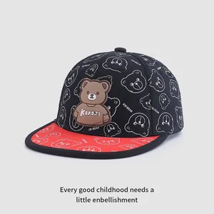 Detail of child baseball cap featuring a 3D bear patch and Kid Bear prints