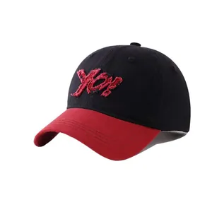 Kids color-block baseball cap featuring red YES embroidery and vintage frayed edges