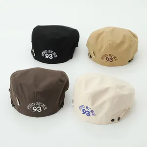 Detailed view of four cotton ivy caps with 'STND BY ME 93' embroidery and side buckles