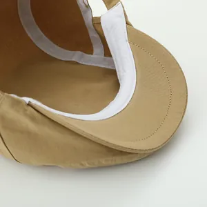 Detail view of khaki cotton cap interior featuring sweatband and reinforced stitching