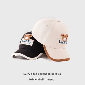 Kids baseball cap with plush lucky bear embroidery in black and beige colors