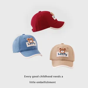 Kids baseball caps with Lucky bear embroidery in red, blue, and khaki canvas colors