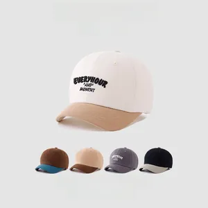Detail of embroidered letters on cotton canvas kids baseball cap with contrast brim color