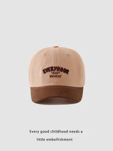 Close-up of contrast color kids baseball cap with detailed EVERYHOUR embroidery