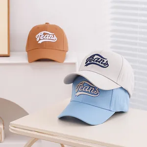 Three kids cotton baseball caps with Jeans embroidery in blue, white and tan colors