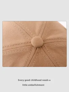 Close-up of the cotton twill crown with reinforced stitching and top button on khaki cap