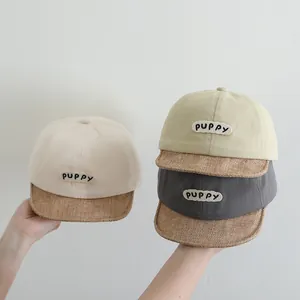 Detailed texture of cotton and linen baby baseball hats with puppy embroidery in 3 colors