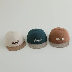 Infant baseball caps with Black embroidery in beige, dark green, and coffee colors