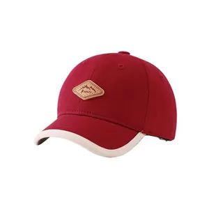 Casquette de baseball enfant bordeaux avec bord contrasté et écusson Kukuji