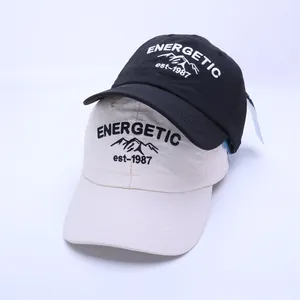 Detail of embroidered energetic text and mountain logo on quick-dry kids baseball caps