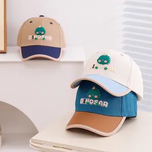 Detailed view of kids dinosaur baseball caps in three colors with 3D silicone patches