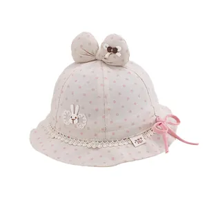 Cute pink polka dot baby sun hat with bunny embroidery and a large bow detail