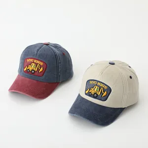 Kids baseball cap featuring vintage washed fabric and embroidered excavator patch