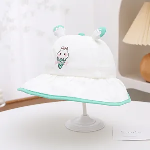 Detailed embroidery of rabbit and ice cream on a white breathable mesh bucket hat
